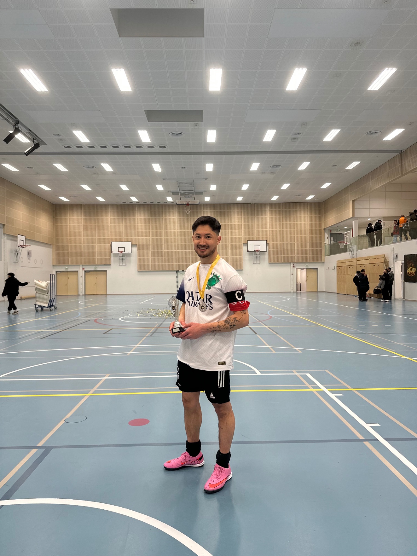 Shirdaghian FC captain holding the tournament trophy